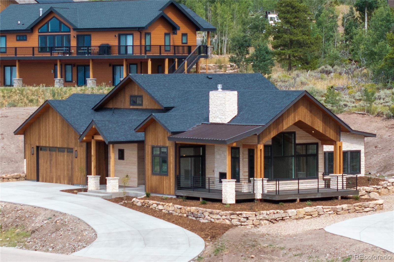 622 Upper Ranch View Drive Granby, CO 80446 - Photo 44 of 50 a front view of a house with a garden and yard