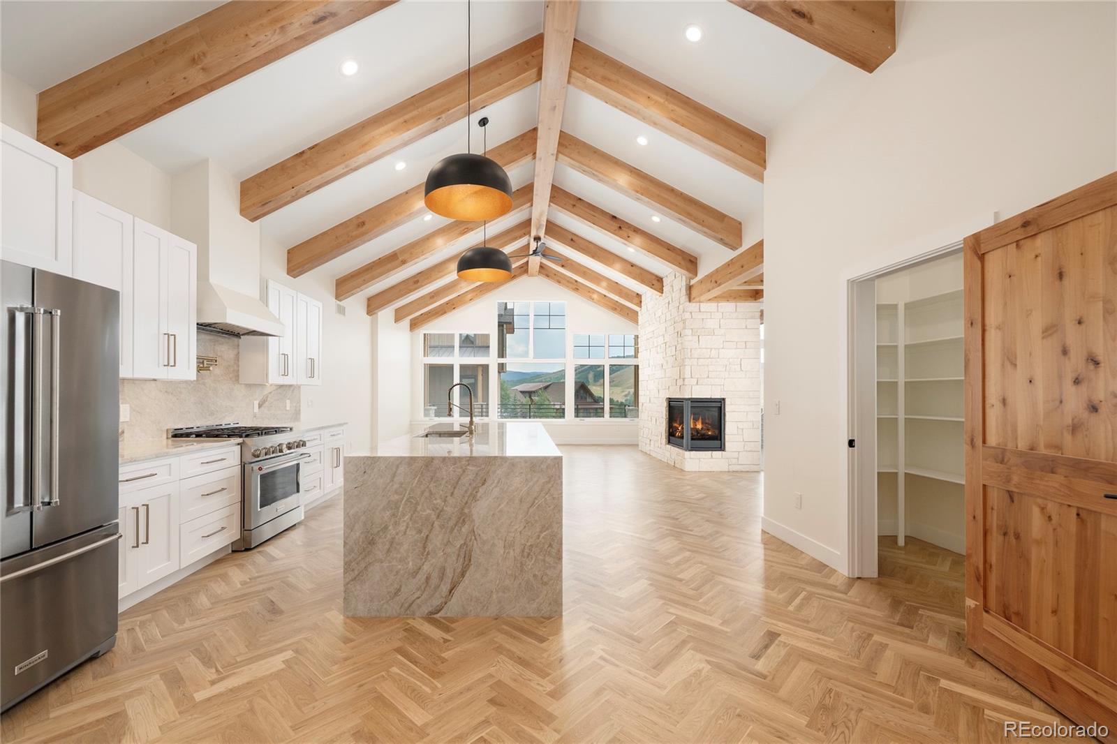 622 Upper Ranch View Drive Granby, CO 80446 - Photo 6 of 50 a kitchen with granite countertop a refrigerator and a stove