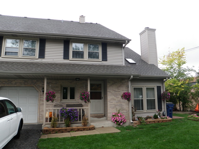 237 Walnut Street, Unit J Elmhurst, IL 60126 - Photo 2 of 8 a front view of house with yard and outdoor seating