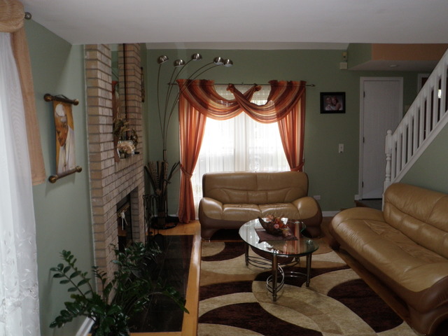 237 Walnut Street, Unit J Elmhurst, IL 60126 - Photo 3 of 8 a living room with furniture and a window