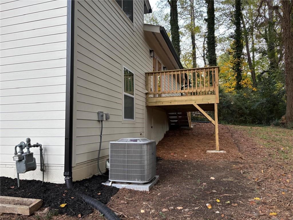 2485 Ortega Way Chamblee, GA 30341 - Photo 22 of 27 a view of a patio with table and chairs and wooden fence
