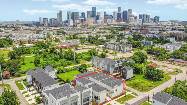 an aerial view of a city with lots of residential buildings