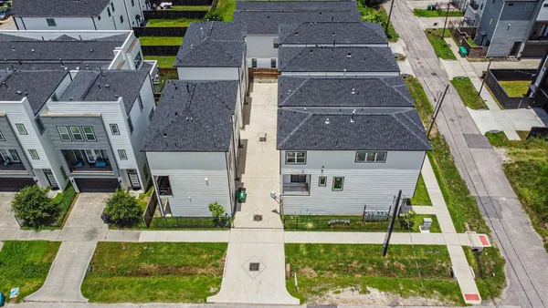an aerial view of a house with swimming pool
