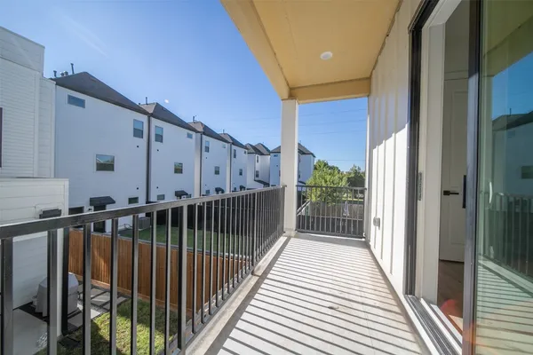 a view of a balcony with wooden floor