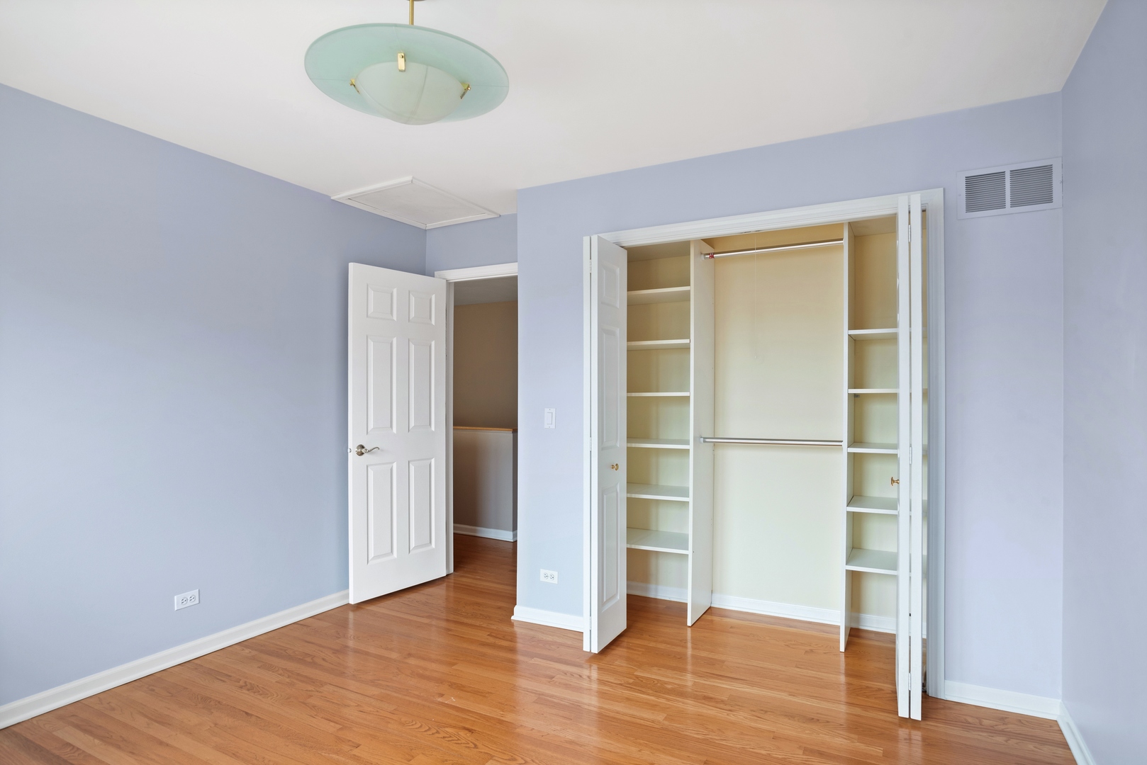 981 Ridge Road Highland Park, IL 60035 - Photo 12 of 15 an empty room with wooden floor and windows
