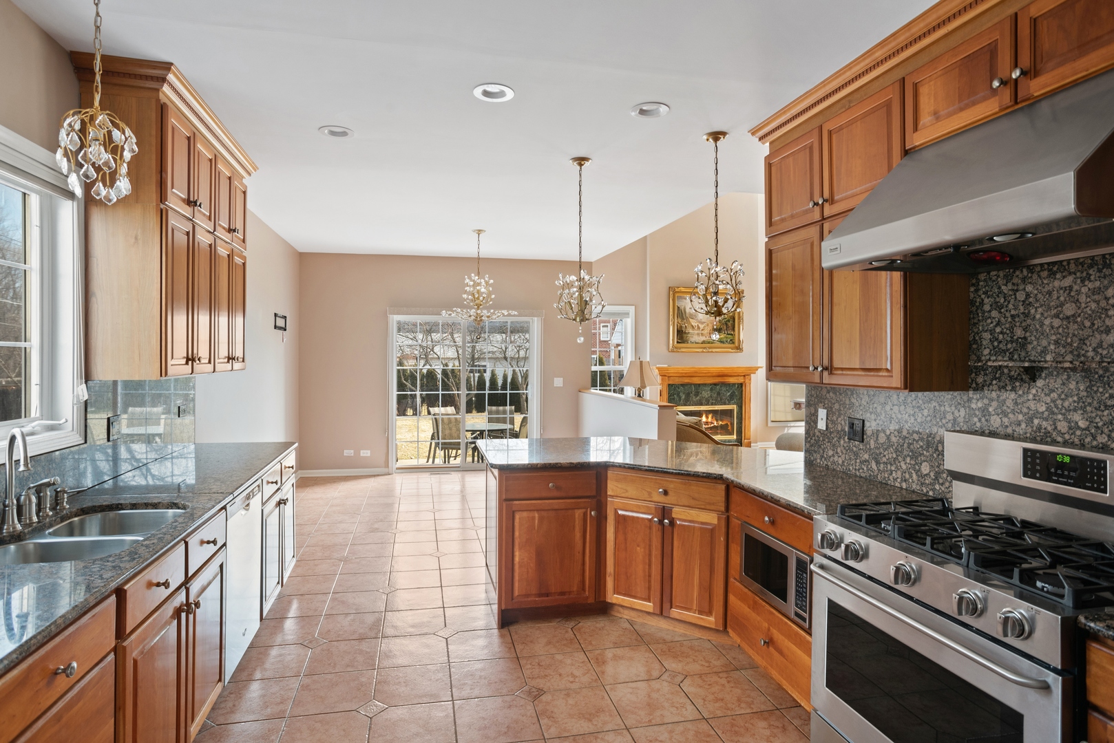 981 Ridge Road Highland Park, IL 60035 - Photo 4 of 15 a large kitchen with stainless steel appliances granite countertop a stove and a sink