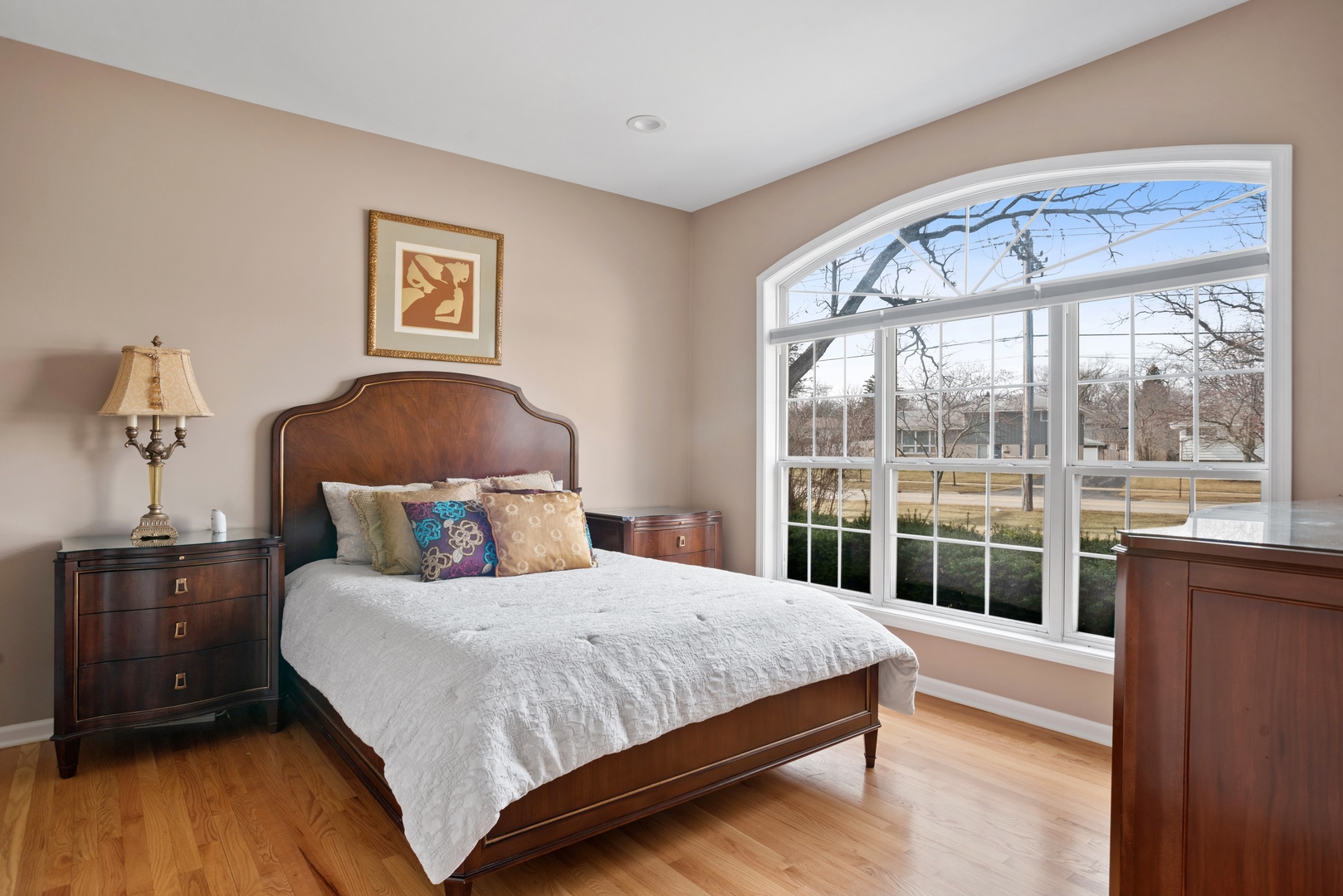 981 Ridge Road Highland Park, IL 60035 - Photo 7 of 15 a bedroom with a large bed and a wooden floor