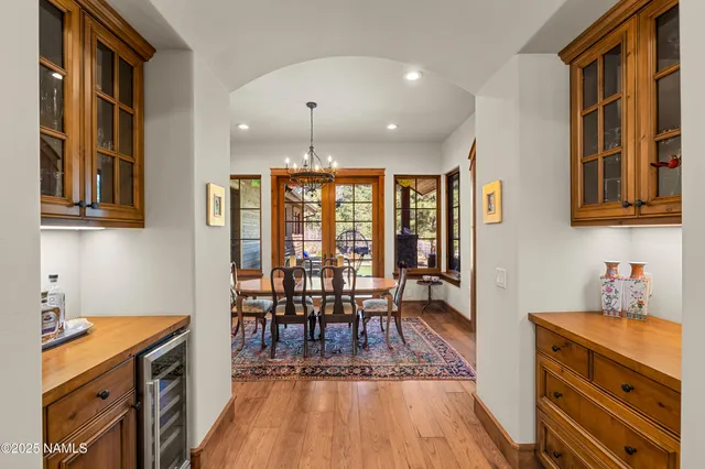 a spacious bedroom with a bed a couch and a window