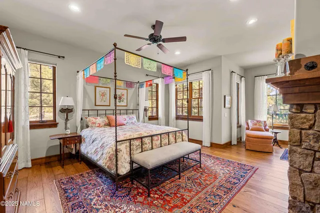 a spacious bathroom with a granite countertop tub and a large window