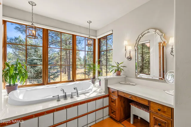 a living room with furniture a window and gym equipment
