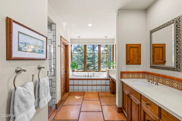 a bedroom with a bed and a dresser with the shoe rack