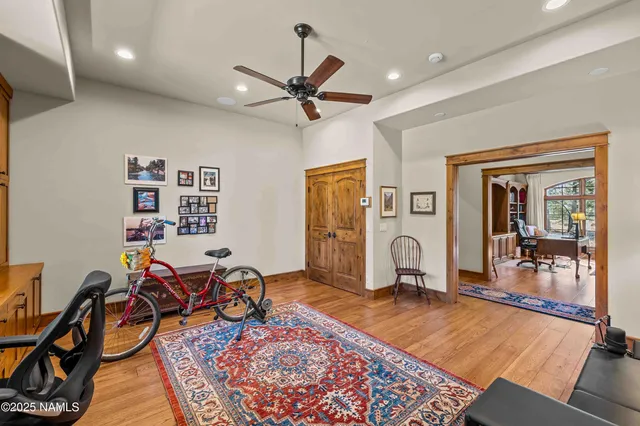 a kitchen with stainless steel appliances kitchen island granite countertop a refrigerator and cabinets