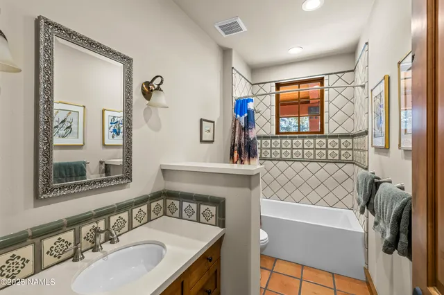 a glass door with outdoor seating