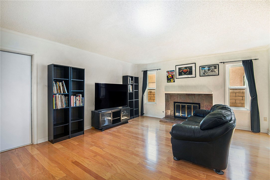 12065 Crystal Glen Way Porter Ranch, CA 91326 - Photo 11 of 38 a living room with furniture and a flat screen tv