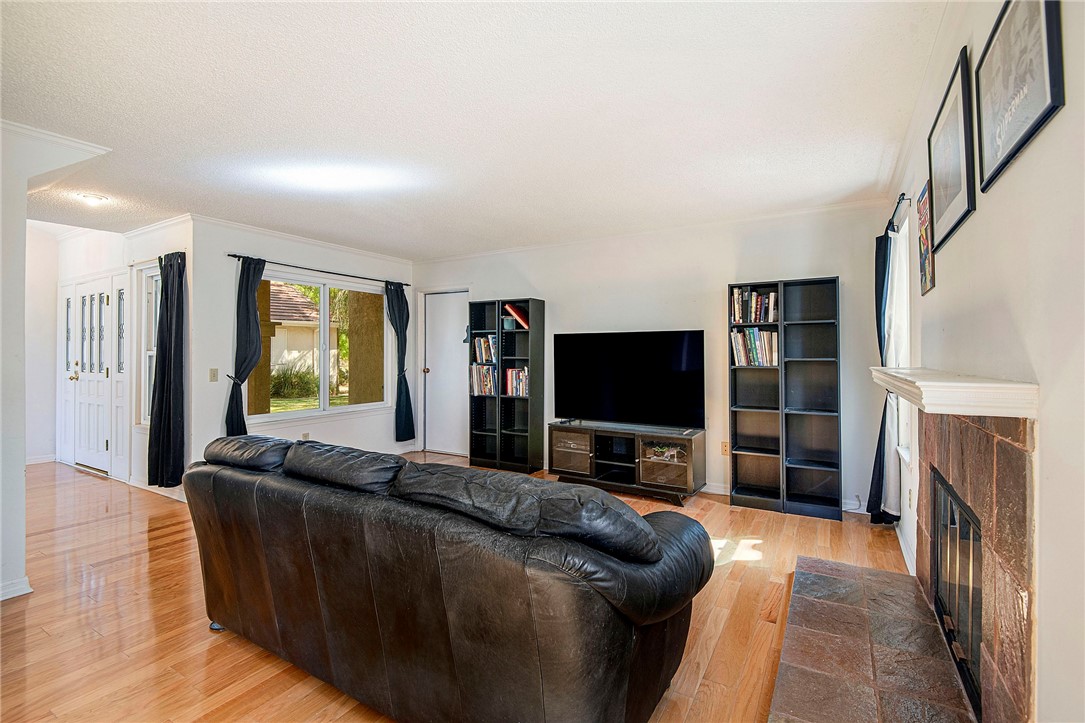 12065 Crystal Glen Way Porter Ranch, CA 91326 - Photo 12 of 38 a living room with furniture and a flat screen tv