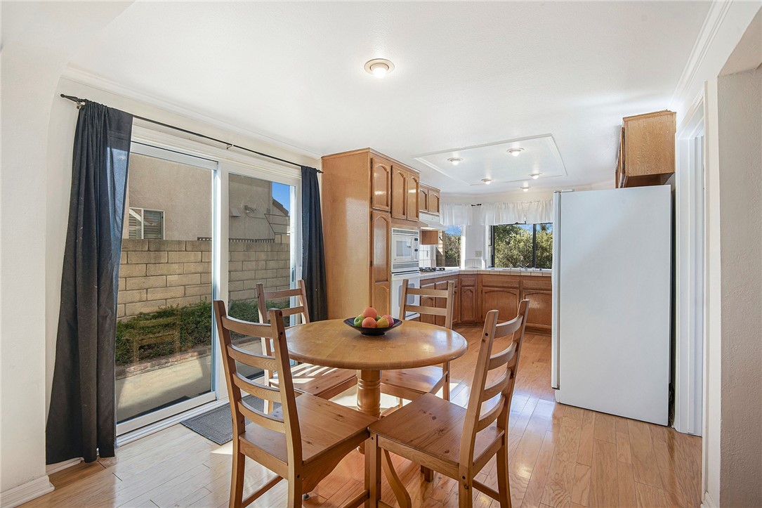 12065 Crystal Glen Way Porter Ranch, CA 91326 - Photo 13 of 38 a dining room with furniture and window
