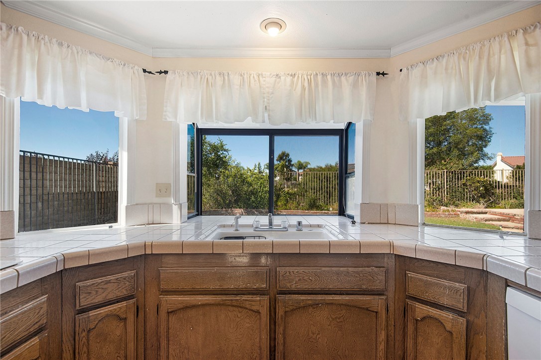 12065 Crystal Glen Way Porter Ranch, CA 91326 - Photo 15 of 38 a kitchen with a sink and a large window