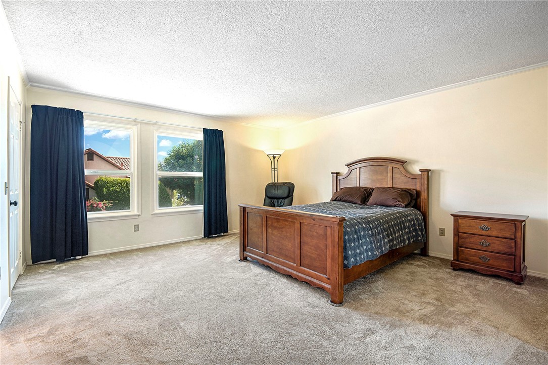 12065 Crystal Glen Way Porter Ranch, CA 91326 - Photo 17 of 38 a living room with a bed furniture and a window