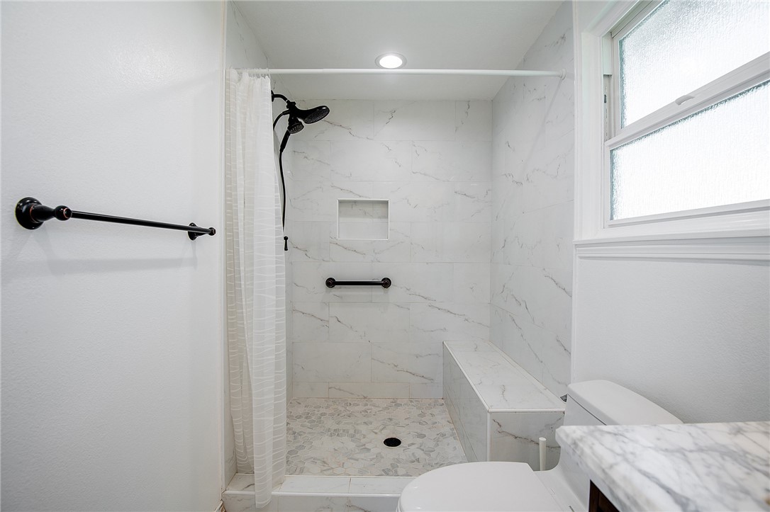 12065 Crystal Glen Way Porter Ranch, CA 91326 - Photo 20 of 38 a bathroom with a granite countertop shower sink vanity and toilet