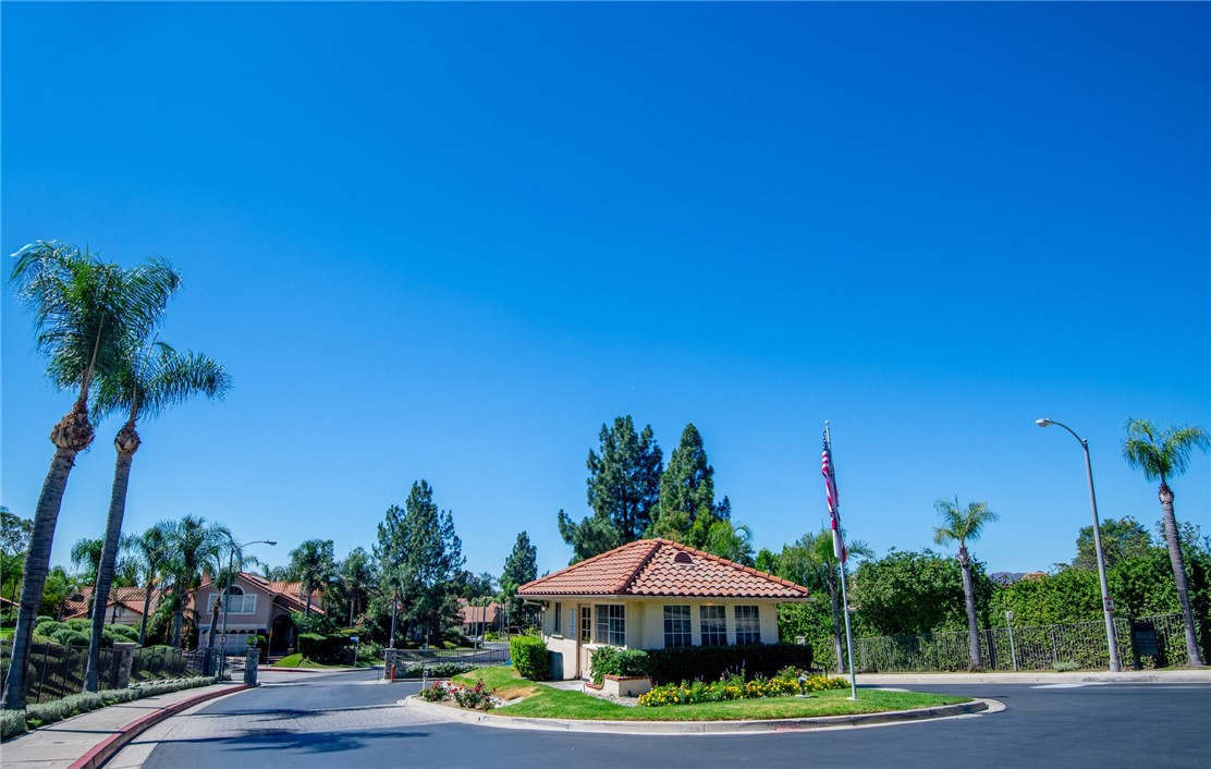 12065 Crystal Glen Way Porter Ranch, CA 91326 - Photo 38 of 38 a front view of a house with a garden and yard