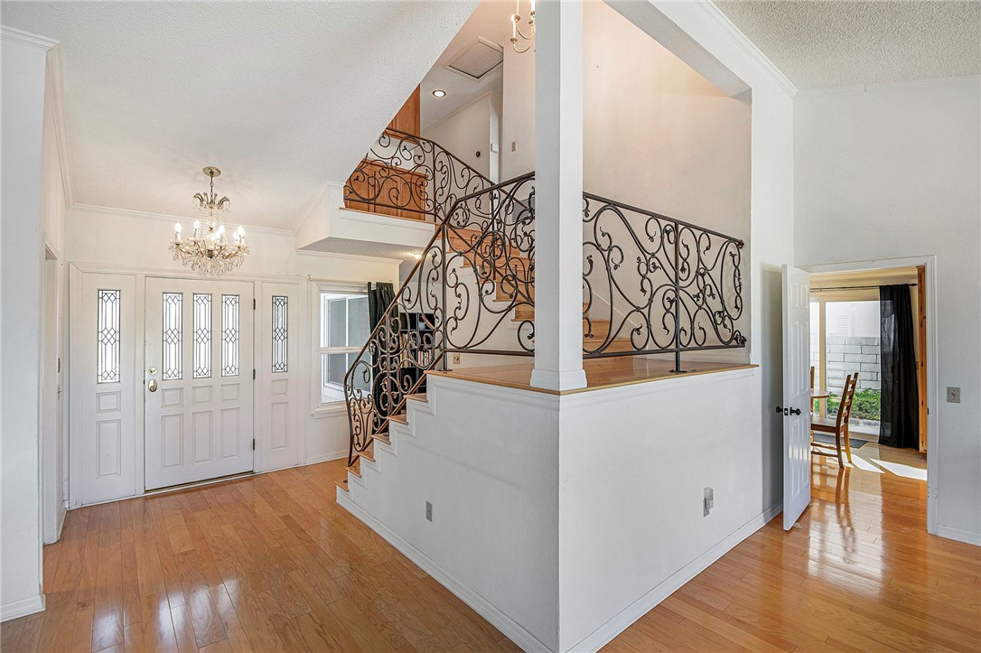 12065 Crystal Glen Way Porter Ranch, CA 91326 - Photo 4 of 38 wooden floor with an entryway