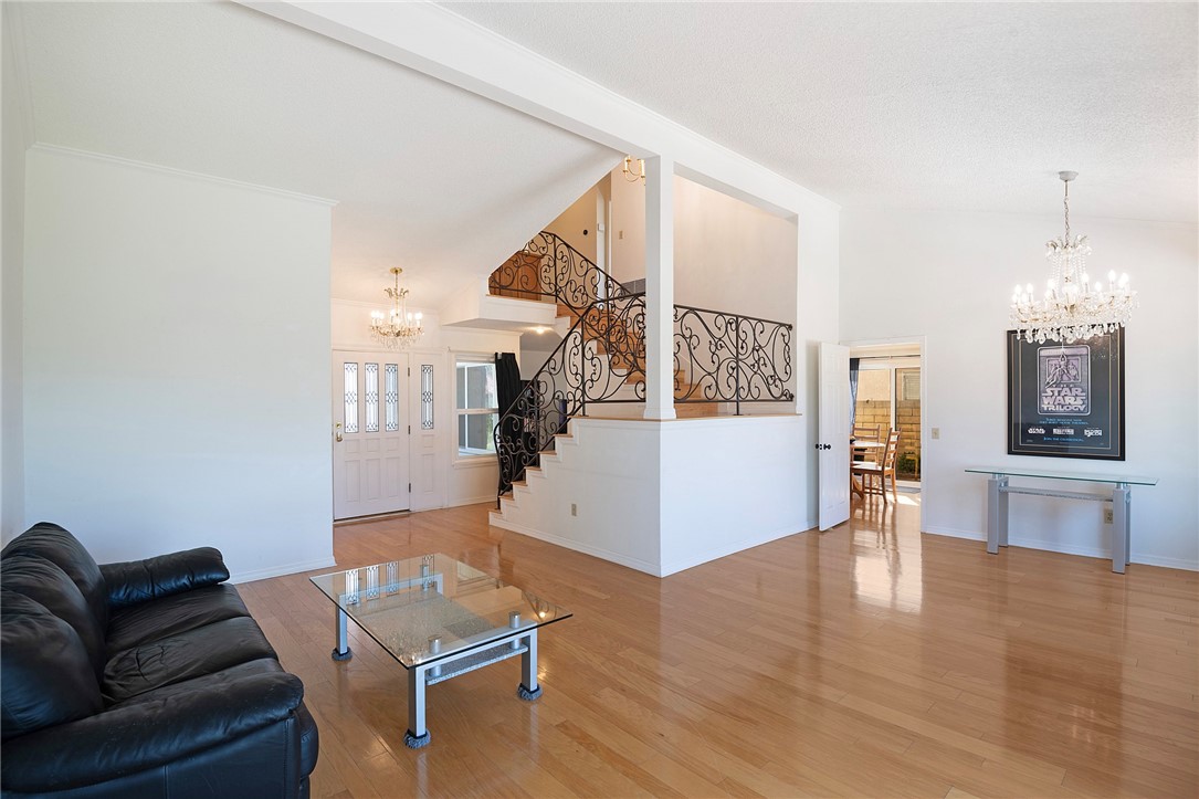 12065 Crystal Glen Way Porter Ranch, CA 91326 - Photo 6 of 38 a living room with furniture and wooden floor