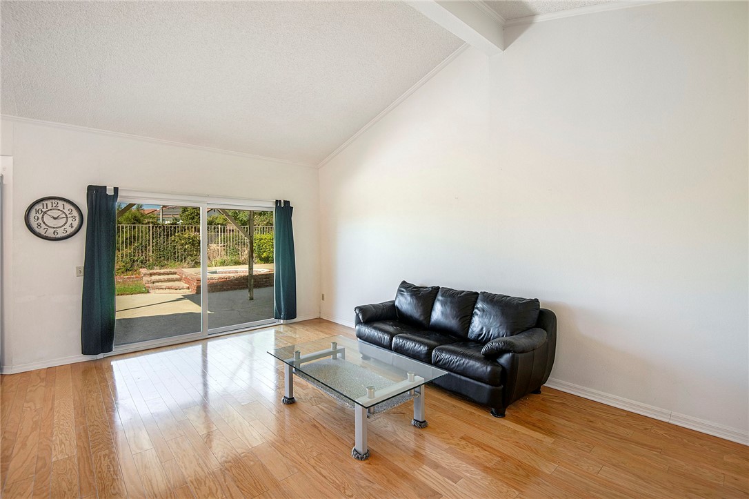 12065 Crystal Glen Way Porter Ranch, CA 91326 - Photo 7 of 38 a living room with furniture and a window