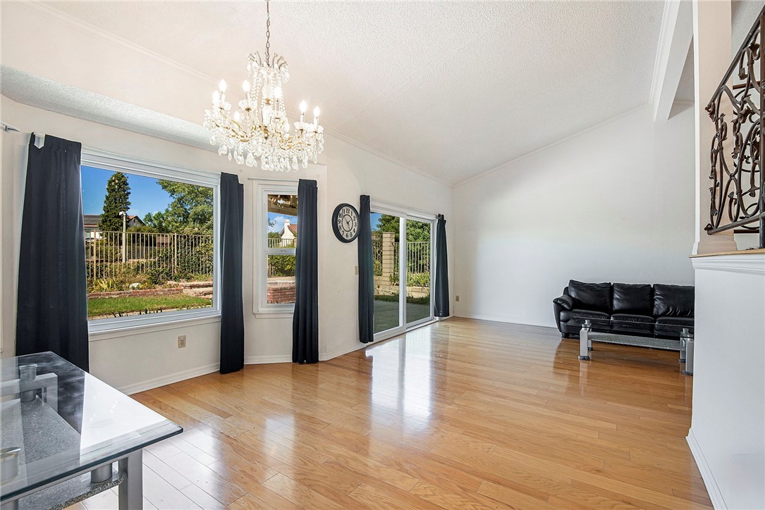 12065 Crystal Glen Way Porter Ranch, CA 91326 - Photo 9 of 38 a view of a livingroom with furniture window and wooden floor