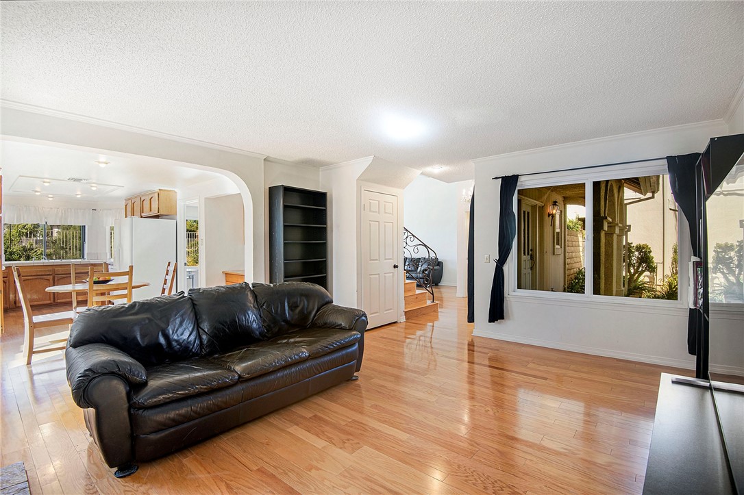 12065 Crystal Glen Way Porter Ranch, CA 91326 - Photo 10 of 38 a living room with furniture and a large window
