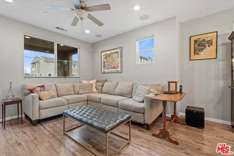 a kitchen with stainless steel appliances granite countertop a sink refrigerator and microwave
