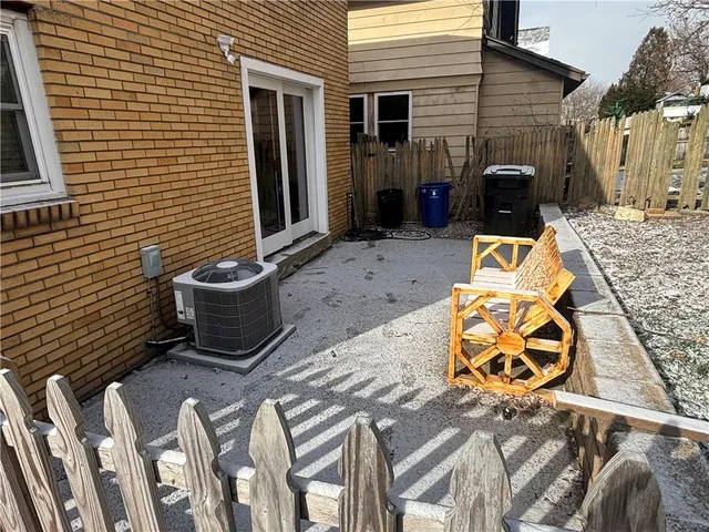 a view of a patio with furniture