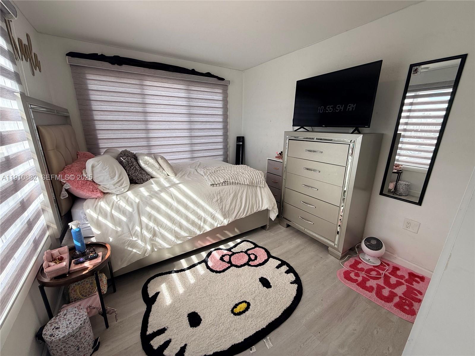 25855 Southwest 139th Court Homestead, FL 33032 - Photo 18 of 23 a bedroom with a bed and flat screen tv