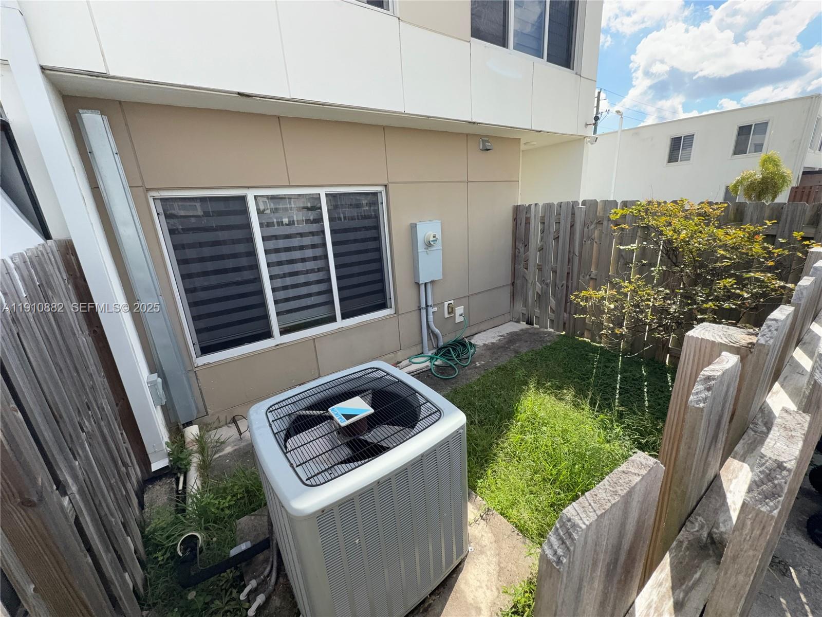 25855 Southwest 139th Court Homestead, FL 33032 - Photo 22 of 23 a front view of a house with garden
