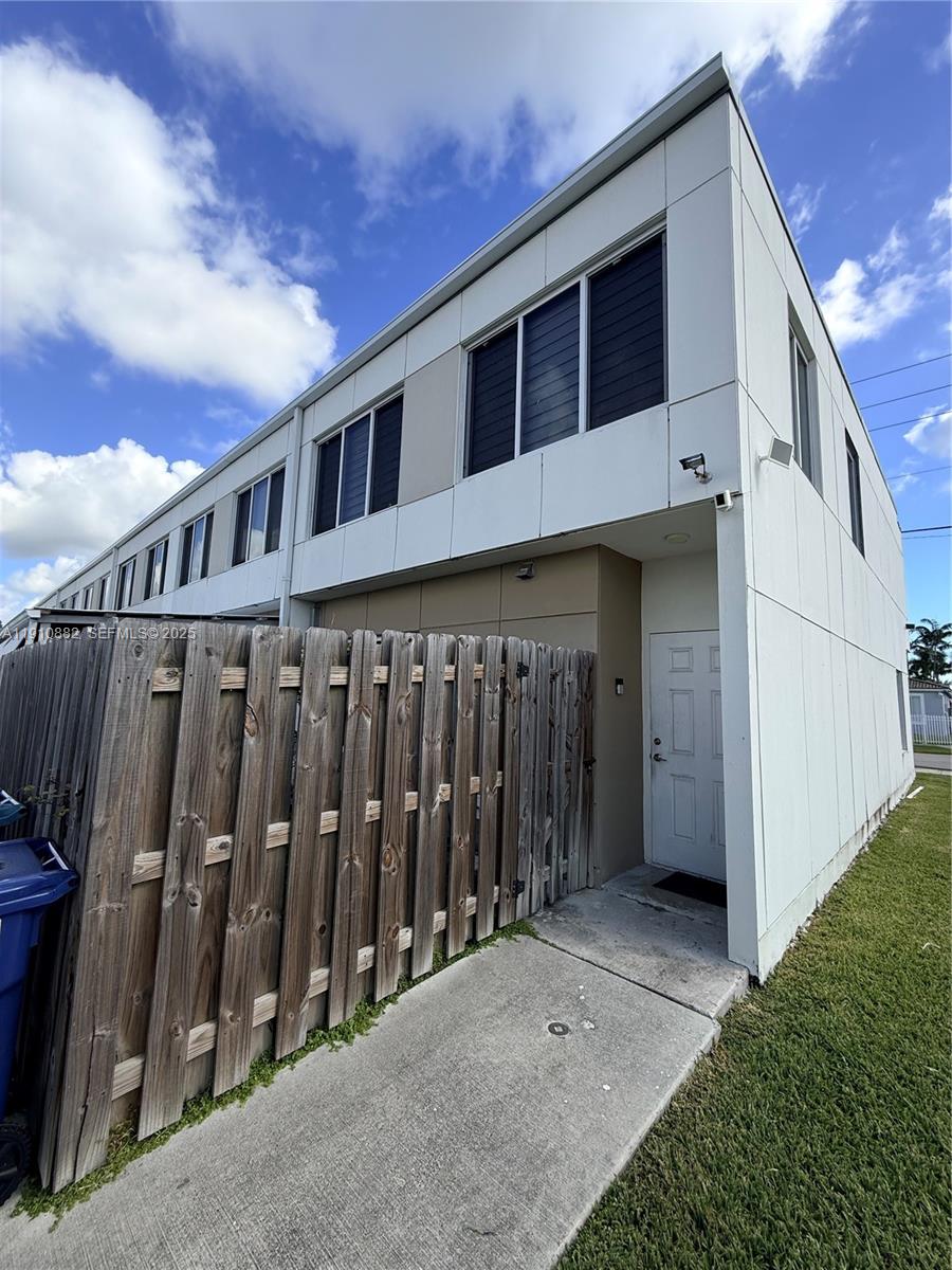 25855 Southwest 139th Court Homestead, FL 33032 - Photo 23 of 23 a view of a house with wooden fence