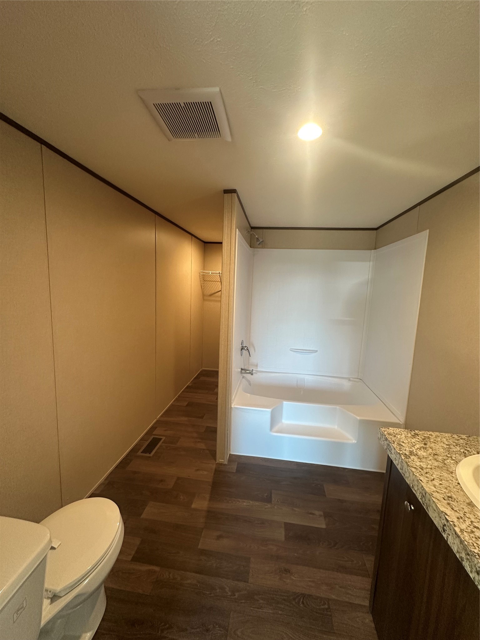 873 Golden Buffalo, TX 75831 - Photo 11 of 12 a bathroom with a granite countertop sink toilet and shower