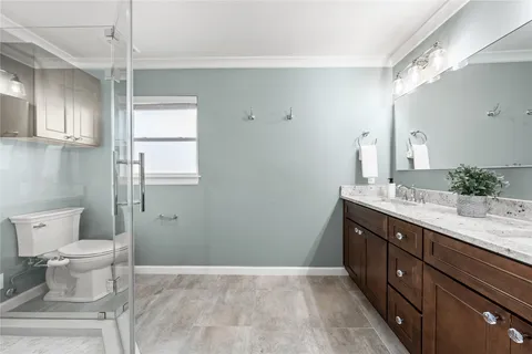 a spacious bedroom with a bed and a window