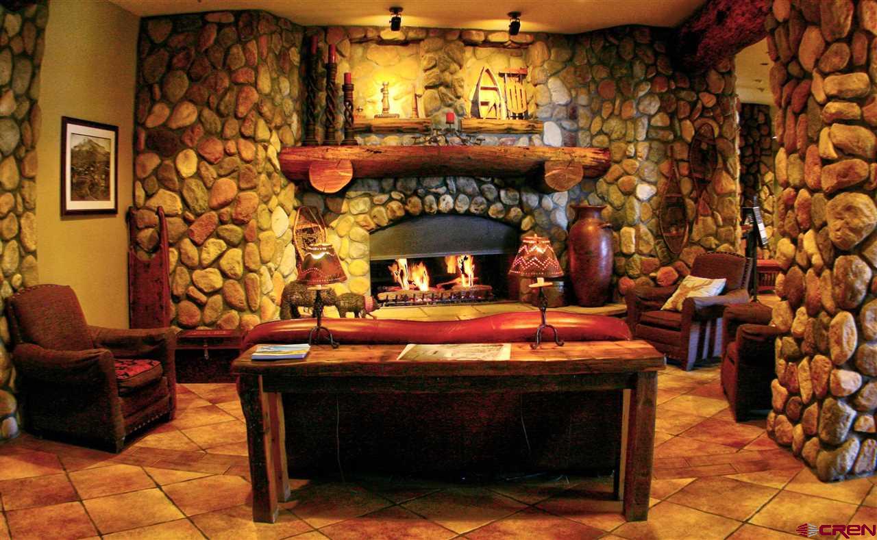 6 Emmons Road, Unit 269 Crested Butte, CO 81225 - Photo 4 of 18 a view of a fireplace with a table in a patio