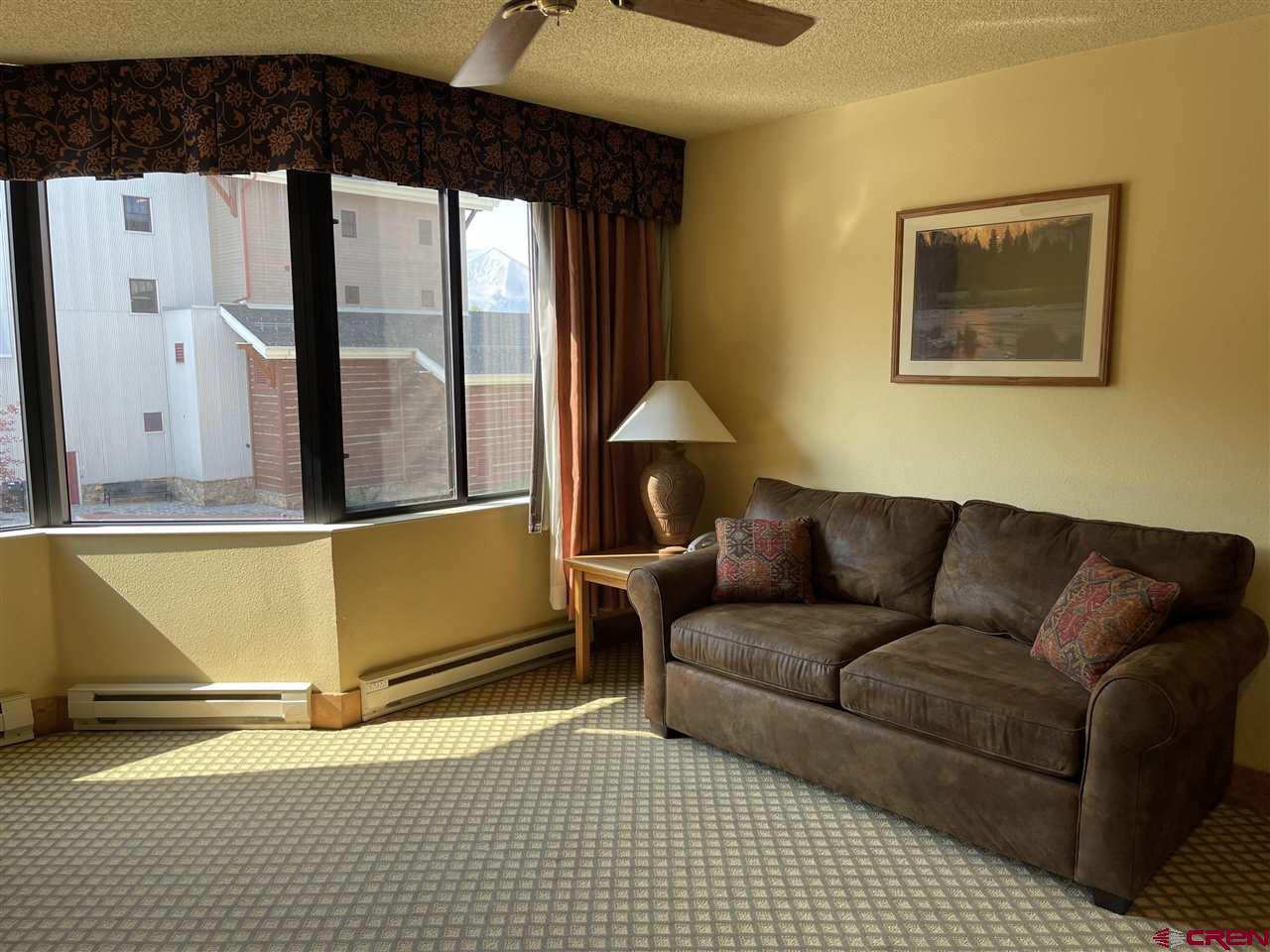 6 Emmons Road, Unit 269 Crested Butte, CO 81225 - Photo 10 of 18 a living room with furniture