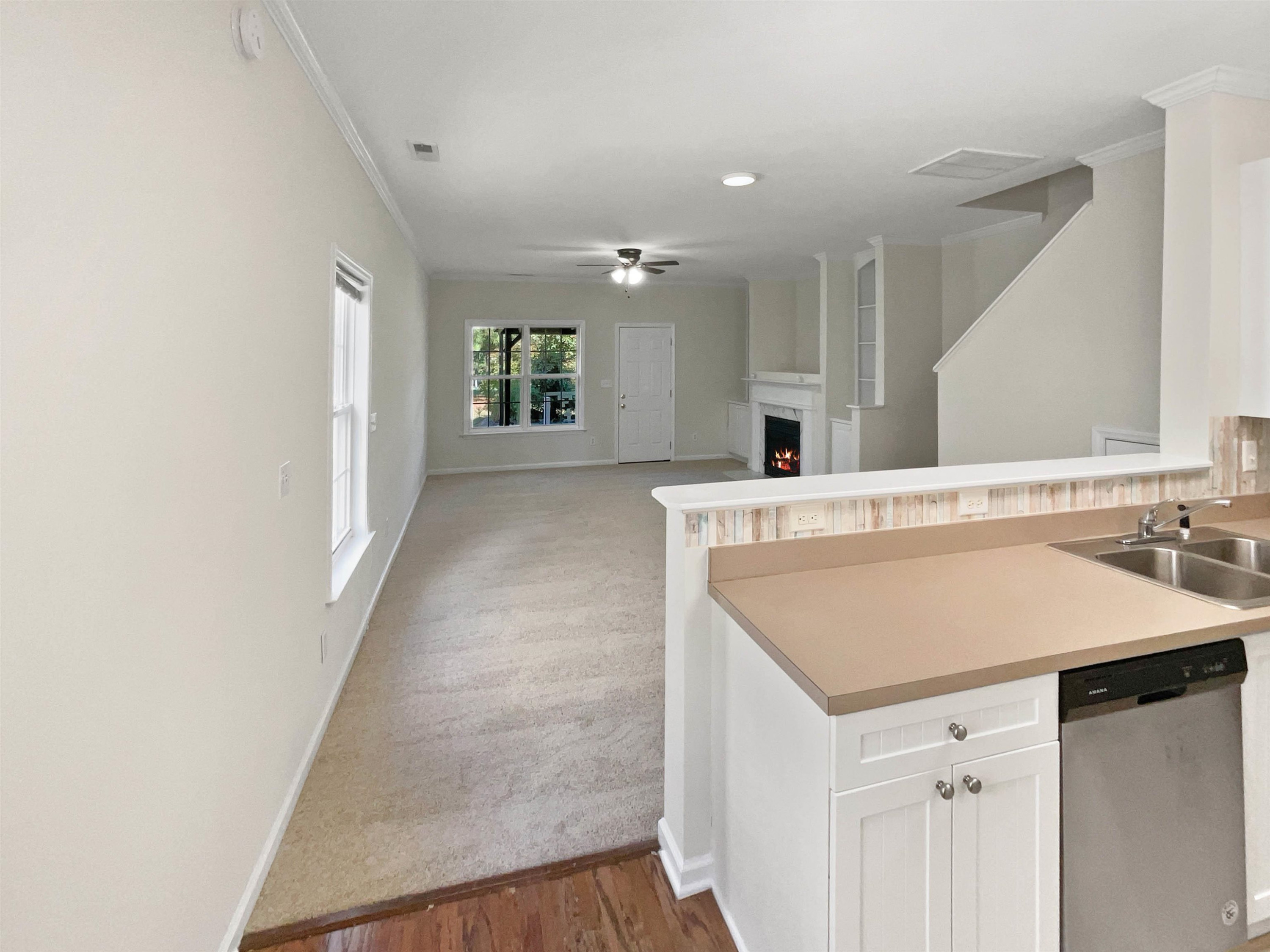 2056 Persimmon Ridge Drive Raleigh, NC 27604 - Photo 5 of 15 a view of a kitchen cabinets a sink and dishwasher with wooden floor