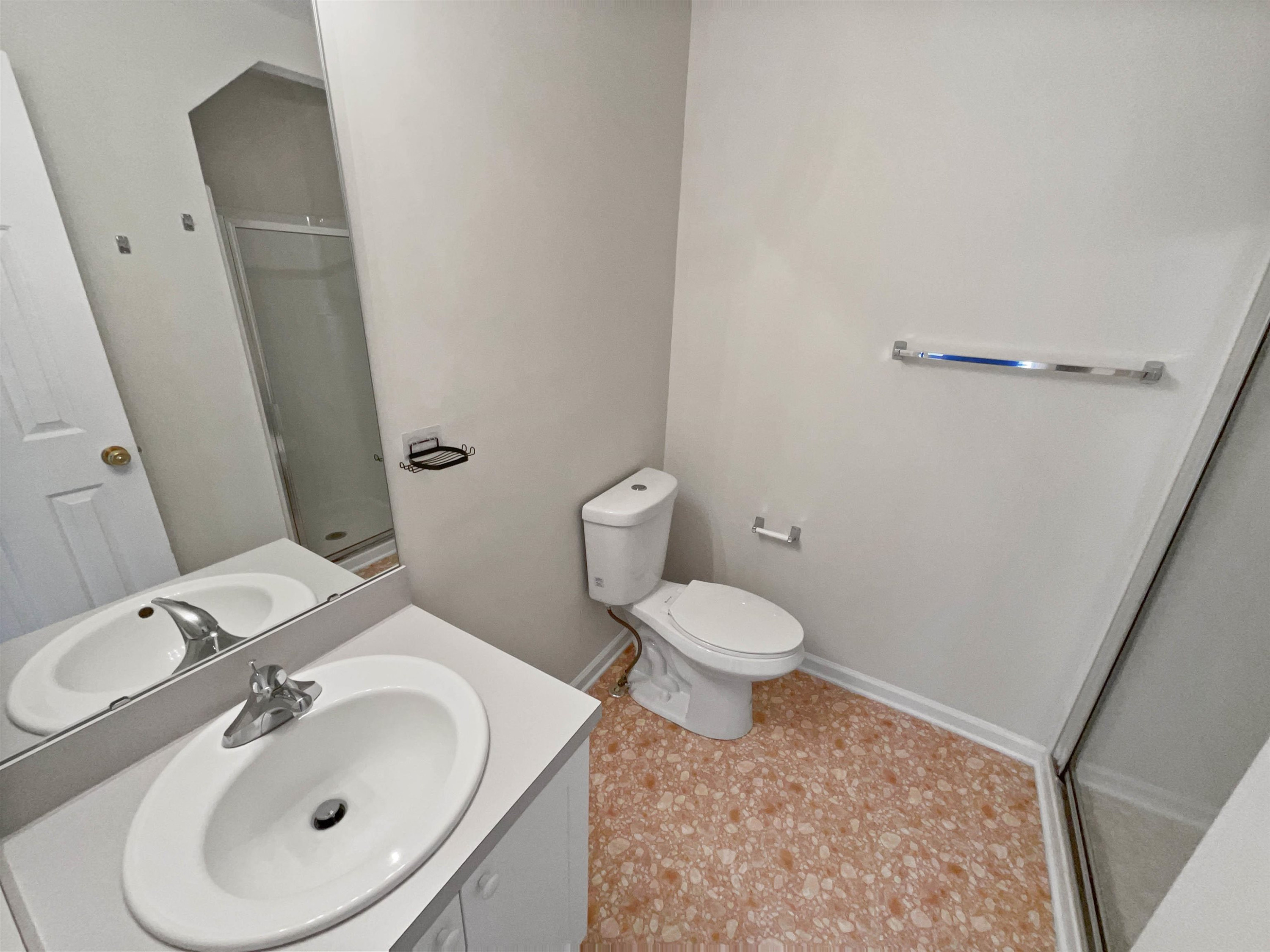 2056 Persimmon Ridge Drive Raleigh, NC 27604 - Photo 9 of 15 a bathroom with a sink a toilet and a mirror