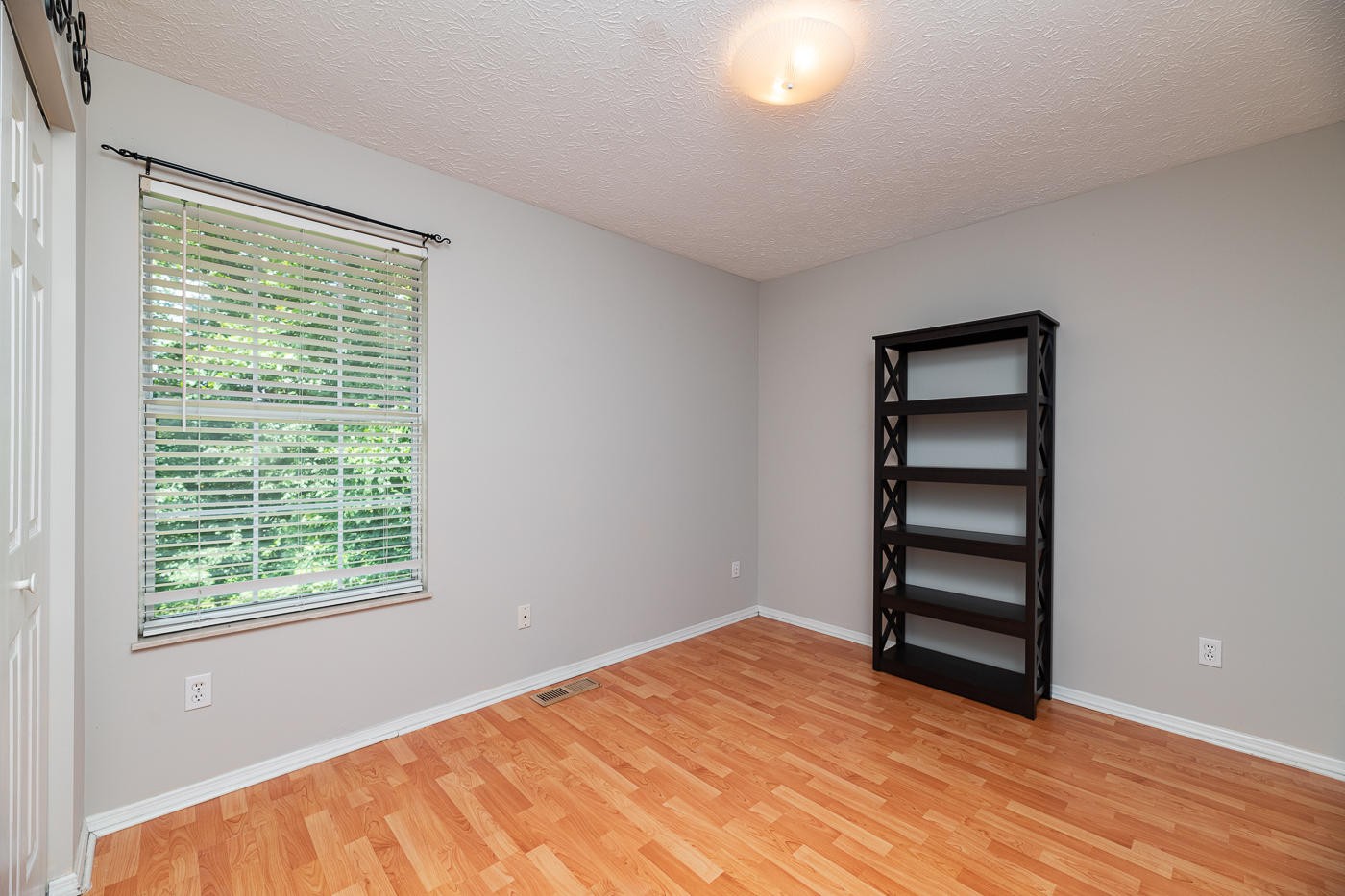 3508 Wexgate Road Knoxville, TN 37931 - Photo 15 of 17 a view of a bedroom with wooden floor and window