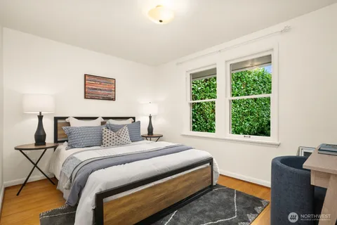a bedroom with a bed and a chair