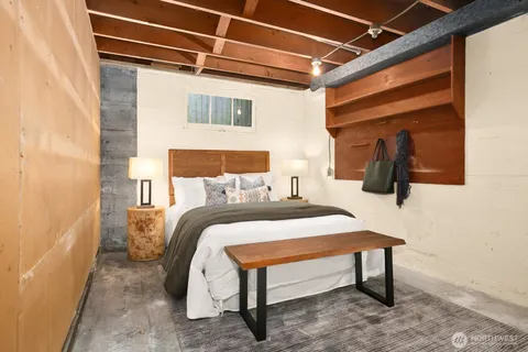 a bedroom with a bed and a table