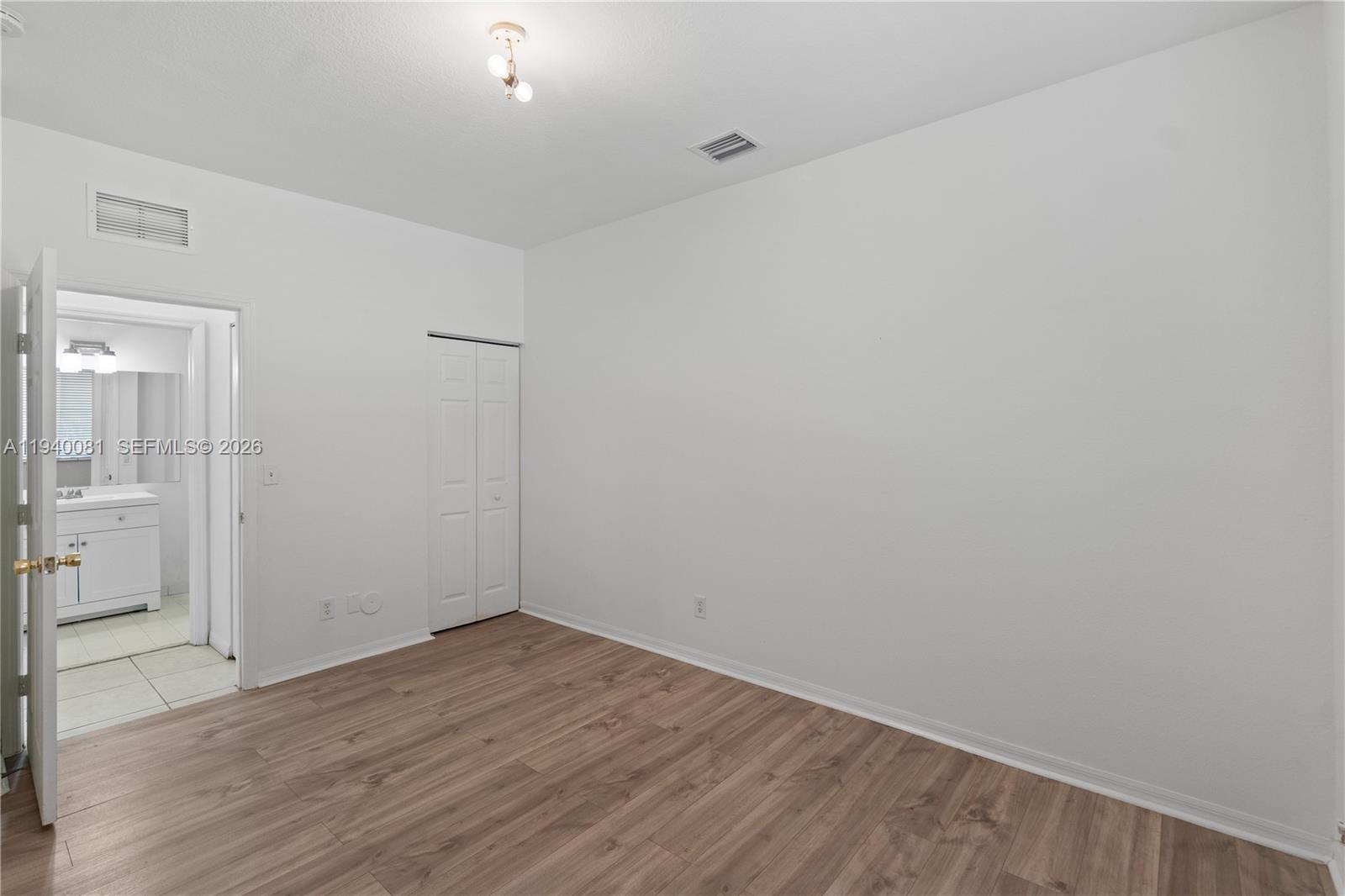 1564 Southwest 2nd Street Homestead, FL 33030 - Photo 15 of 29 wooden floor in an empty room