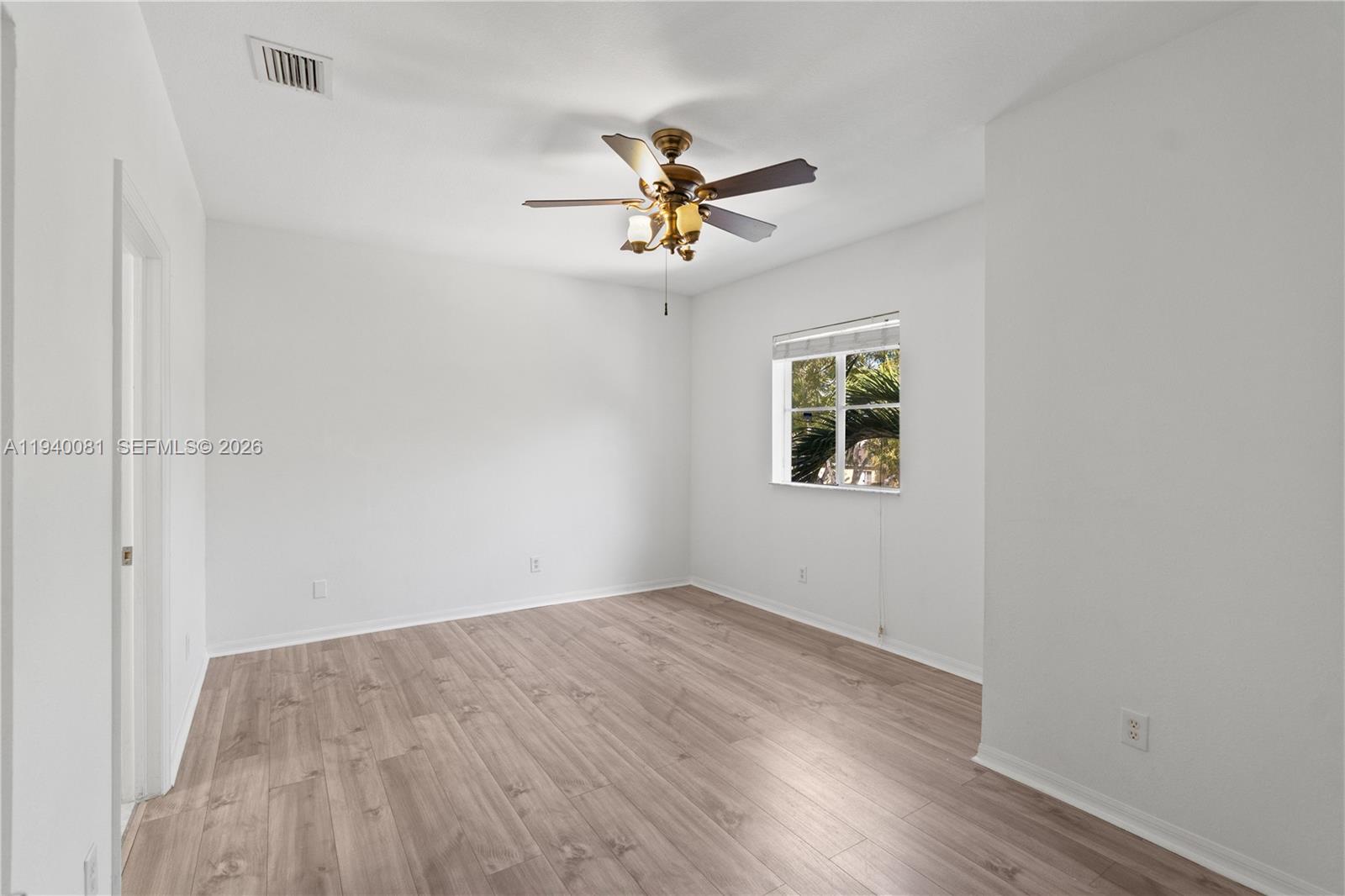1564 Southwest 2nd Street Homestead, FL 33030 - Photo 19 of 29 wooden floor in a room next to a window