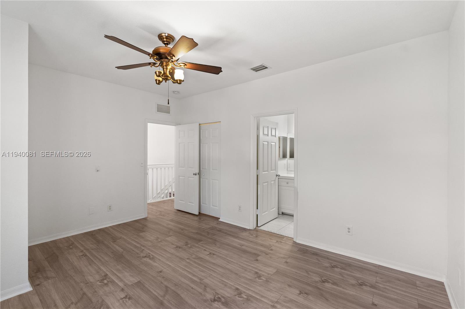 1564 Southwest 2nd Street Homestead, FL 33030 - Photo 20 of 29 wooden floor in an empty room with a window