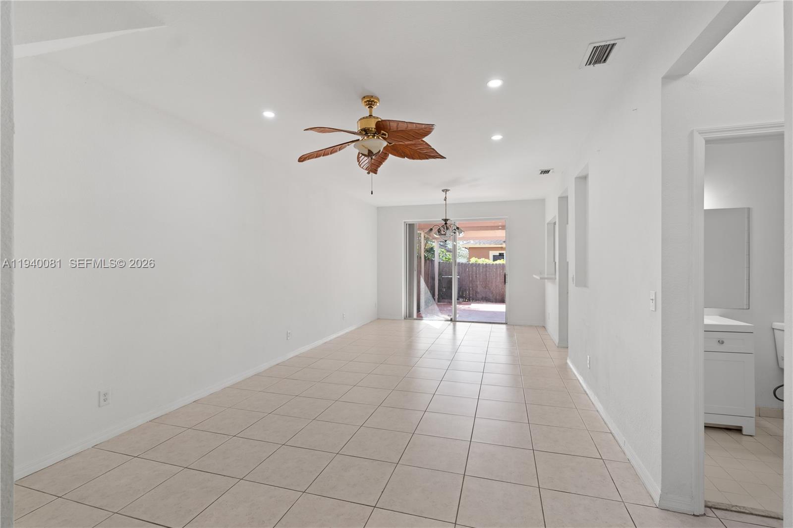 1564 Southwest 2nd Street Homestead, FL 33030 - Photo 2 of 29 a view of a hallway with a chandelier