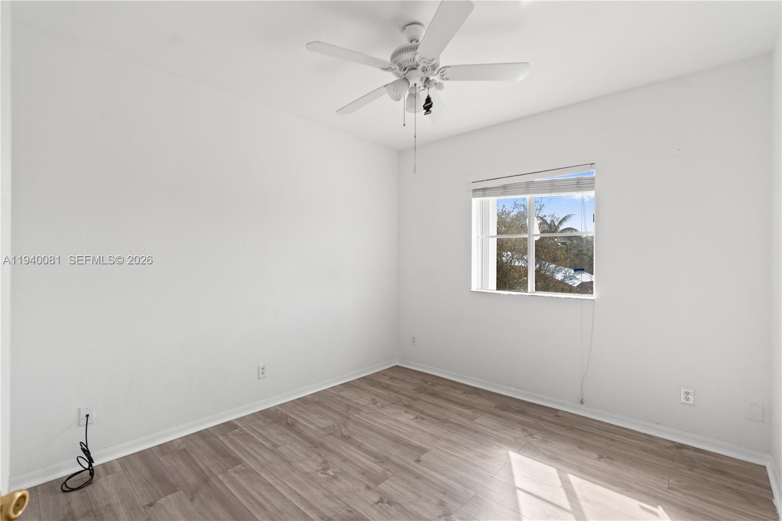 1564 Southwest 2nd Street Homestead, FL 33030 - Photo 23 of 29 an empty room with a window