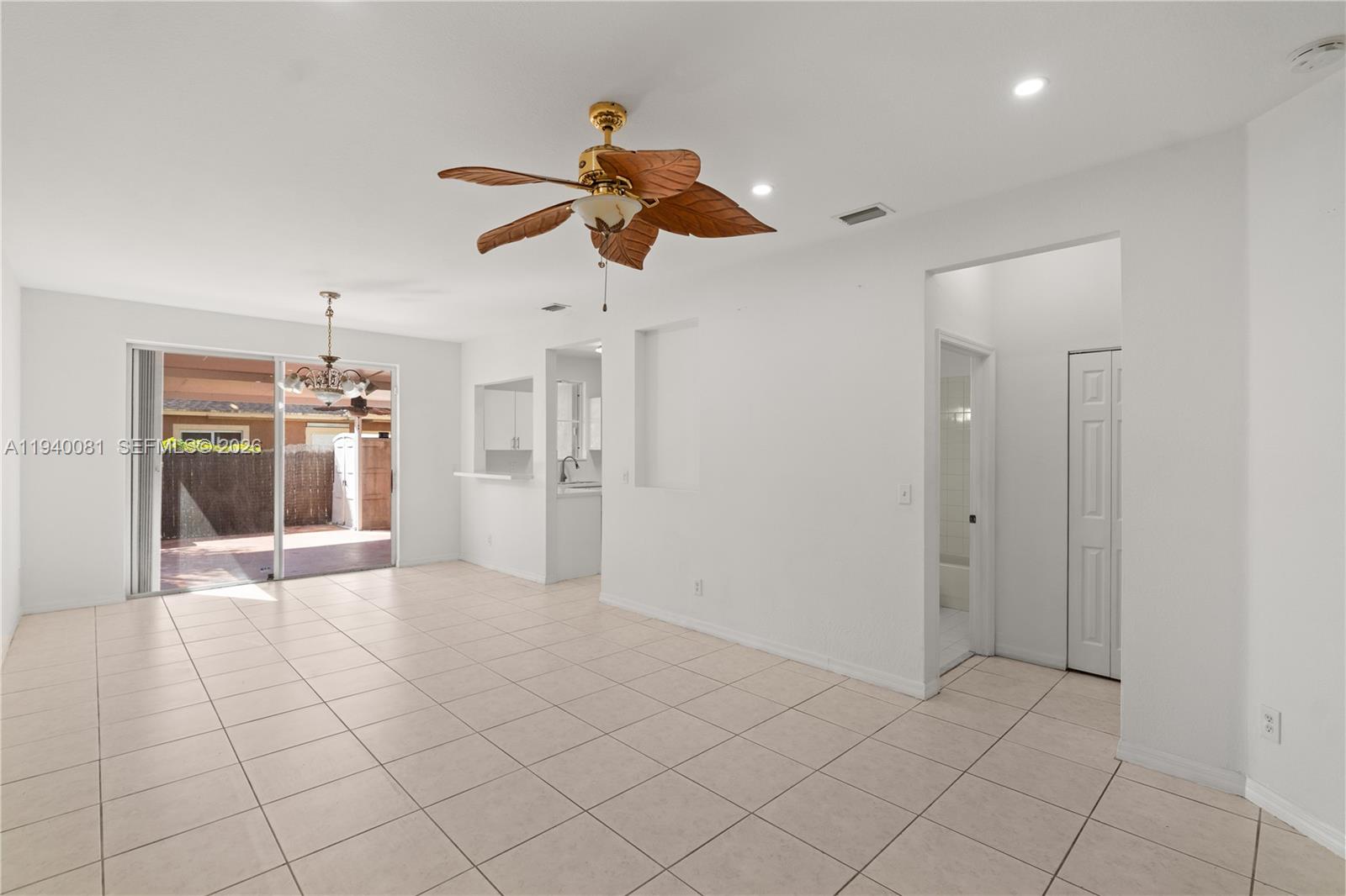 1564 Southwest 2nd Street Homestead, FL 33030 - Photo 3 of 29 a view of a kitchen and a chandelier fan