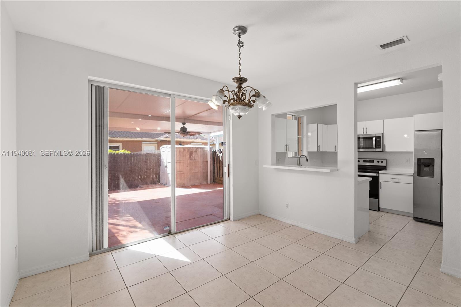 1564 Southwest 2nd Street Homestead, FL 33030 - Photo 4 of 29 a open kitchen with refrigerator and sink